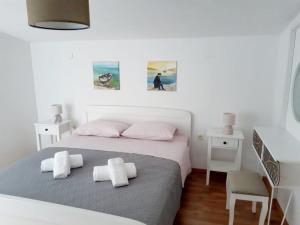 Postel nebo postele na pokoji v ubytování Apartman Šime