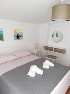 Postel nebo postele na pokoji v ubytování Apartman Šime