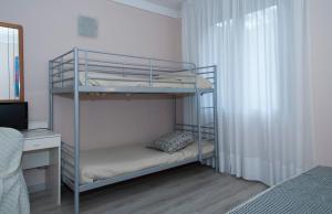 Postel nebo postele na pokoji v ubytování Hotel Monti