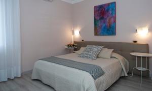 Postel nebo postele na pokoji v ubytování Hotel Monti