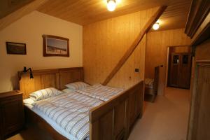 Postel nebo postele na pokoji v ubytování Apartmány Chalupa u Floriánka
