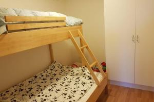 a bunk bed in a room with a bunk bed at Modern villa i Arild med spektakulär havsutsikt. in Arild