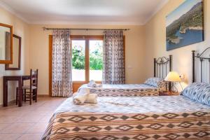 Łóżko lub łóżka w pokoju w obiekcie Finca SON PERIS by Mallorca Villa Selection