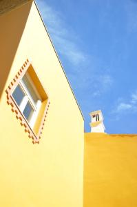 a building with a window on the side of it at HI Tavira – Pousada de Juventude in Tavira