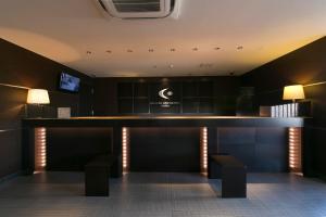 a bar in the lobby of a hotel at Center One Hotel Handa in Handa