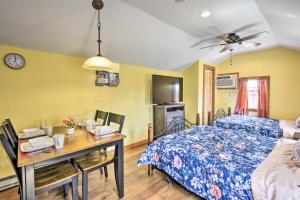 a bedroom with a bed and a desk with a table at Pleasant Mount Studio with Pool Access, Near Skiing! in Pleasant Mount
