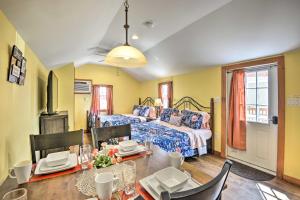 a bedroom with a bed and a table with chairs at Pleasant Mount Studio with Pool Access, Near Skiing! in Pleasant Mount