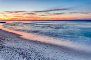 a view of the beach at sunset at South Walton Condos II in Inlet Beach