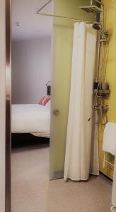 Postelja oz. postelje v sobi nastanitve Hotel y Estudios DCeres Estancias