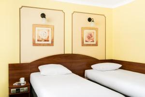 Posteľ alebo postele v izbe v ubytovaní Hotel Wersal