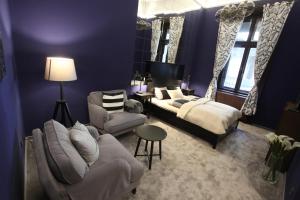 Posteľ alebo postele v izbe v ubytovaní Ambassador Apartment