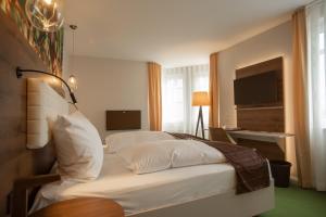 Postel nebo postele na pokoji v ubytování Das Schokoladenhotel