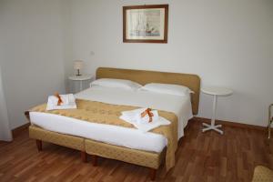 Posteľ alebo postele v izbe v ubytovaní Residence Ancona