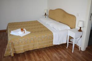 Posteľ alebo postele v izbe v ubytovaní Residence Ancona