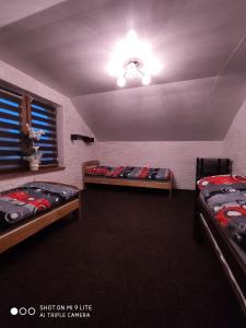 a room with three bunk beds and a window at Apartament Aurelia in Świnoujście