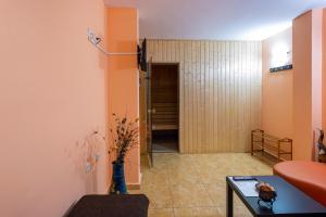 a hallway with a door leading to a room at Family Hotel Jemelly in Obzor