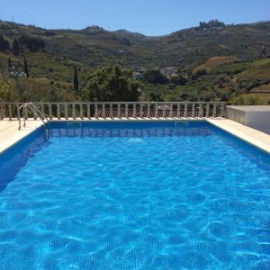a swimming pool with a view of a mountain at Quinta do Fôjo in Lamego +55 photos