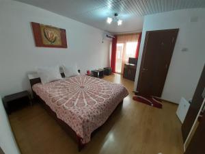 Postel nebo postele na pokoji v ubytování Vila Albatros