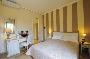 Postel nebo postele na pokoji v ubytování Hotel Dei Conti