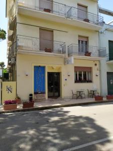 a building on the side of a street at Hotel Nettuno in Porto San Giorgio