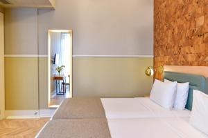 
Uma cama ou camas num quarto em My Story Hotel Tejo
