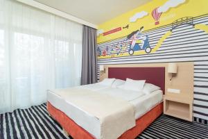 Posteľ alebo postele v izbe v ubytovaní Kolping Family Resort