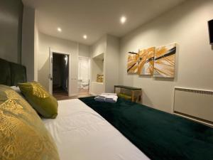Säng eller sängar i ett rum på Junqueira76 Guesthouse