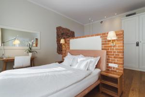 Postel nebo postele na pokoji v ubytování Apartamenty Bracka 6