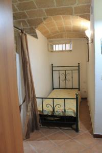 a bedroom with a bed in a room at Bilocale Dillo alla luna in Gallipoli