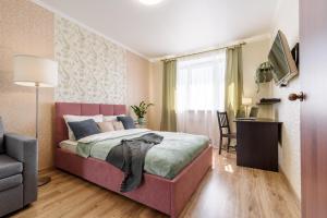 
A bed or beds in a room at Apartments near Pulkovo Airport and Expoforum
