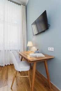 TV a/nebo společenská místnost v ubytování Apartamenty Bracka 6
