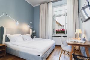 Postel nebo postele na pokoji v ubytování Apartamenty Bracka 6
