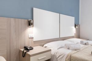 A bed or beds in a room at New Gallery