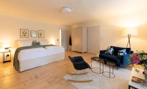 Postel nebo postele na pokoji v ubytování Boutique Hotel Zum Oberjäger, Schloss Lackenbach