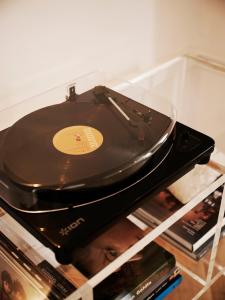 a record player sitting on top of a shelf at Weymouth Mews in London