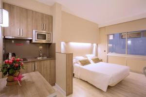 Postel nebo postele na pokoji v ubytování Aparthotel Silver