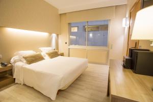 Postel nebo postele na pokoji v ubytování Aparthotel Silver
