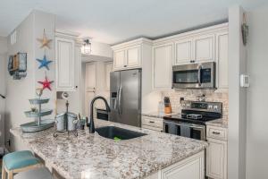 A kitchen or kitchenette at Sea Oats Condos