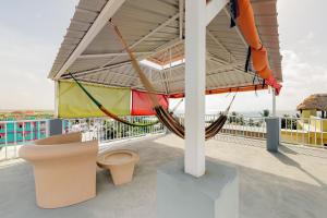 a hammock on the roof of a house at Laguna Suites in San Pedro