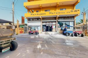 a store front with several vehicles parked in front of it at Laguna Suites in San Pedro