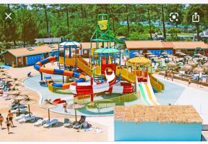 a water park with a water slide at a playground at Maison bord mer in Labenne