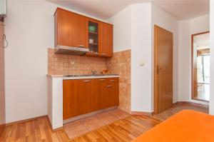 Kuchyň nebo kuchyňský kout v ubytování Apartments Ricina