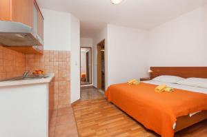 Postel nebo postele na pokoji v ubytování Apartments Ricina