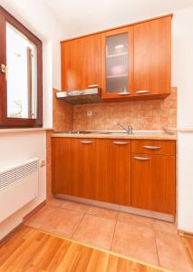 Kuchyň nebo kuchyňský kout v ubytování Apartments Ricina