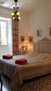 En eller flere senge i et værelse på Villa Primavera