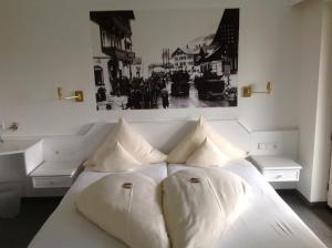 Postel nebo postele na pokoji v ubytování Hotel-Garni Fels