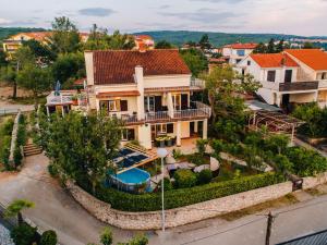 an aerial view of a house with a swimming pool at Villa Sarah in Klimno