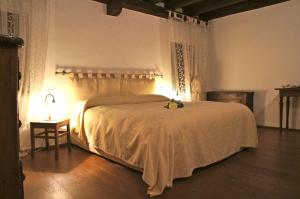 Postel nebo postele na pokoji v ubytování Agriturismo Ronchi Di Sant'Egidio