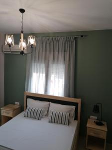 A bed or beds in a room at Green Island Residence