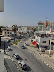 an aerial view of a city street with cars at Pearl City View Apartment in Paphos City